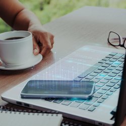 Image of a remote worker at home and using a mobile and laptop